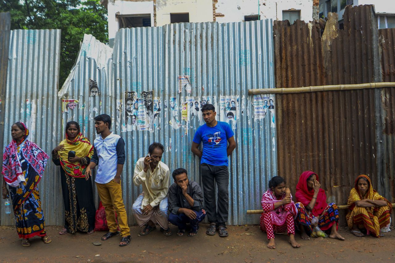 Relatives of men arrested in the nationwide crackdown wait for their release outside a Dhaka court.