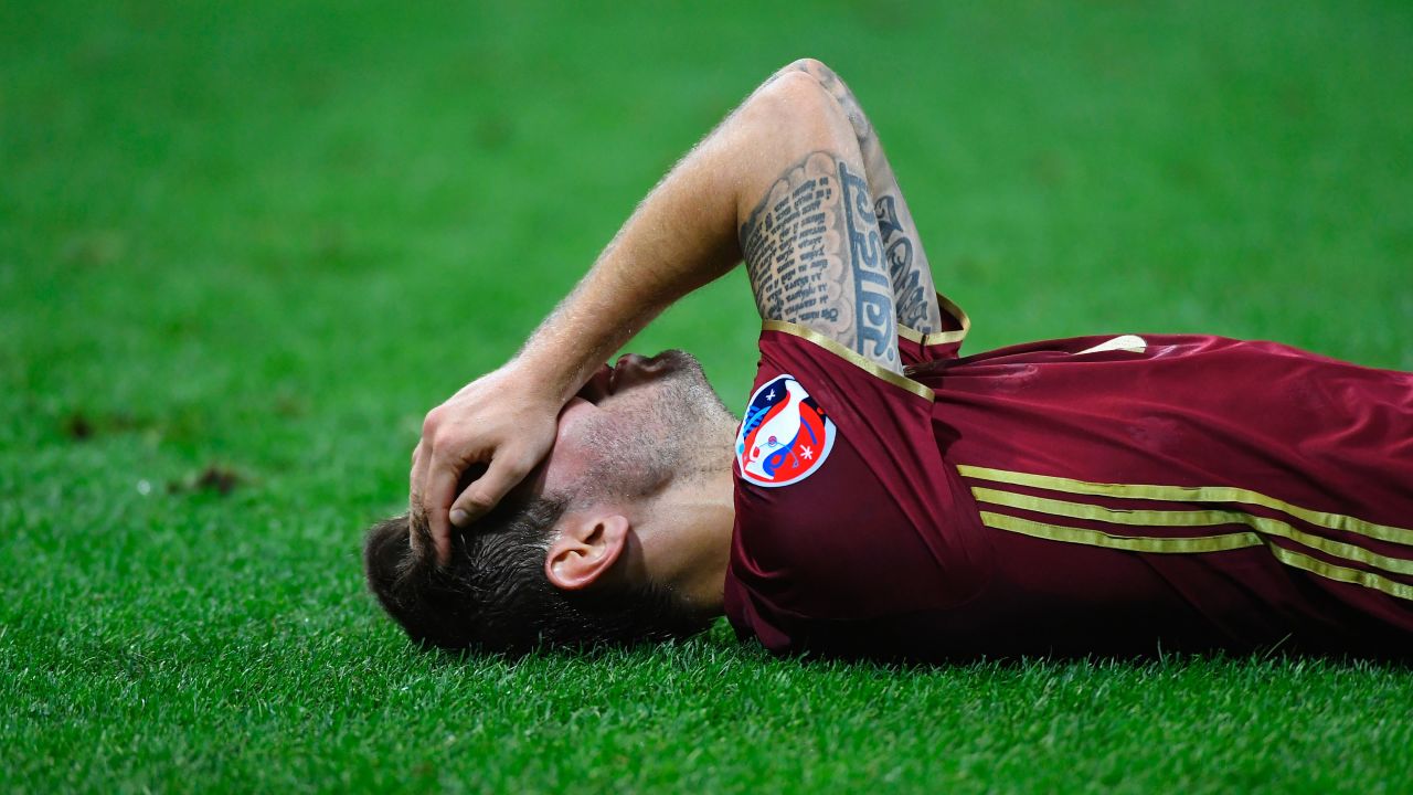 Russian forward Fedor Smolov lies on the field at the end of the match.