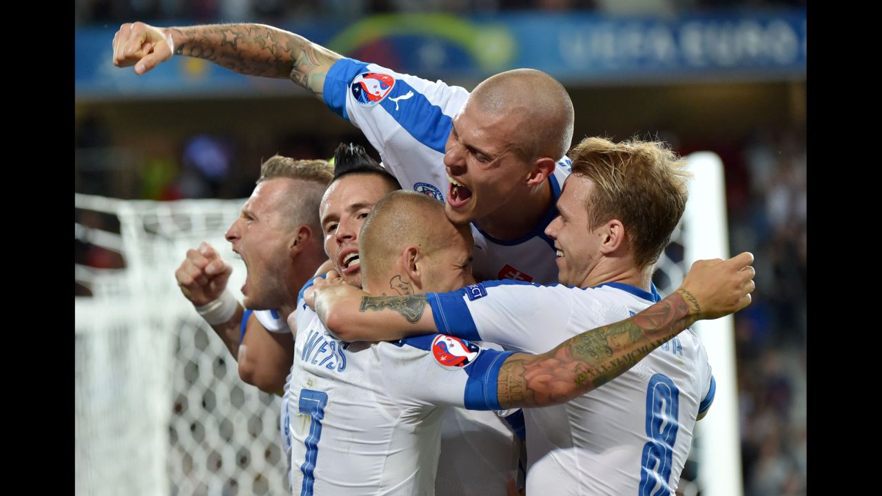 Slovakian players celebrate Hamsik's goal, which gave them a 2-0 lead just before halftime.