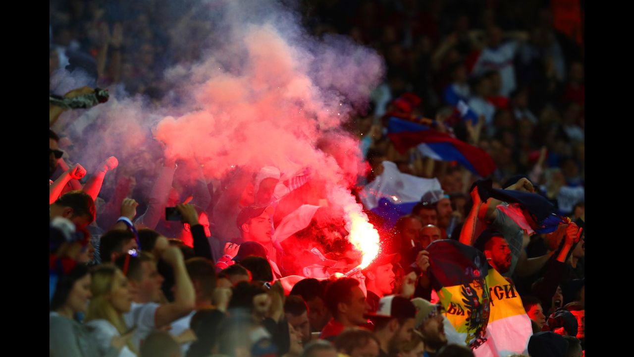 A flare is seen in the crowd where Russia supporters were sitting.
