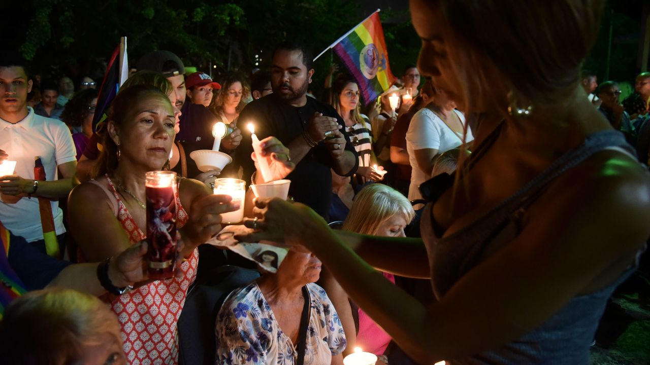 People remember the victims during a vigil at an LGBT community center in San Juan, Puerto Rico, on Tuesday, June 14. 
