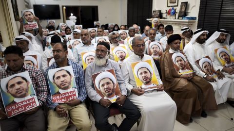 Al-Wefaq supporters hold portraits of leader Sheikh Ali Salman on May 29, in protest against his arrest.
