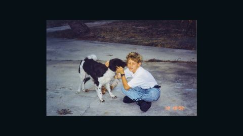 Bradley Weidenhamer embraces a dog in 1992, the year before he died after being attacked by an alligator.