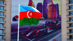 BAKU, AZERBAIJAN - JUNE 16: The Azerbaijan flag flies in front of a building with an F1 car graphic on during previews ahead of the European Formula One Grand Prix at Baku City Circuit on June 16, 2016 in Baku, Azerbaijan.  (Photo by Dan Istitene/Getty Images,)