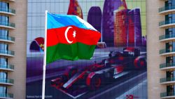 BAKU, AZERBAIJAN - JUNE 16: The Azerbaijan flag flies in front of a building with an F1 car graphic on during previews ahead of the European Formula One Grand Prix at Baku City Circuit on June 16, 2016 in Baku, Azerbaijan.  (Photo by Dan Istitene/Getty Images,)