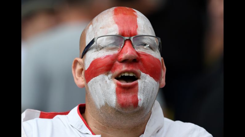 An England supporter smiles at the stadium.