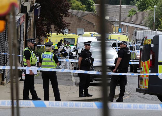Police gather near the scene of the attack in Birstall on June 16.