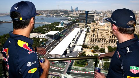 Red Bull Racing's Daniel Ricciardo and Max Verstappen look down on the Baku City Circuit