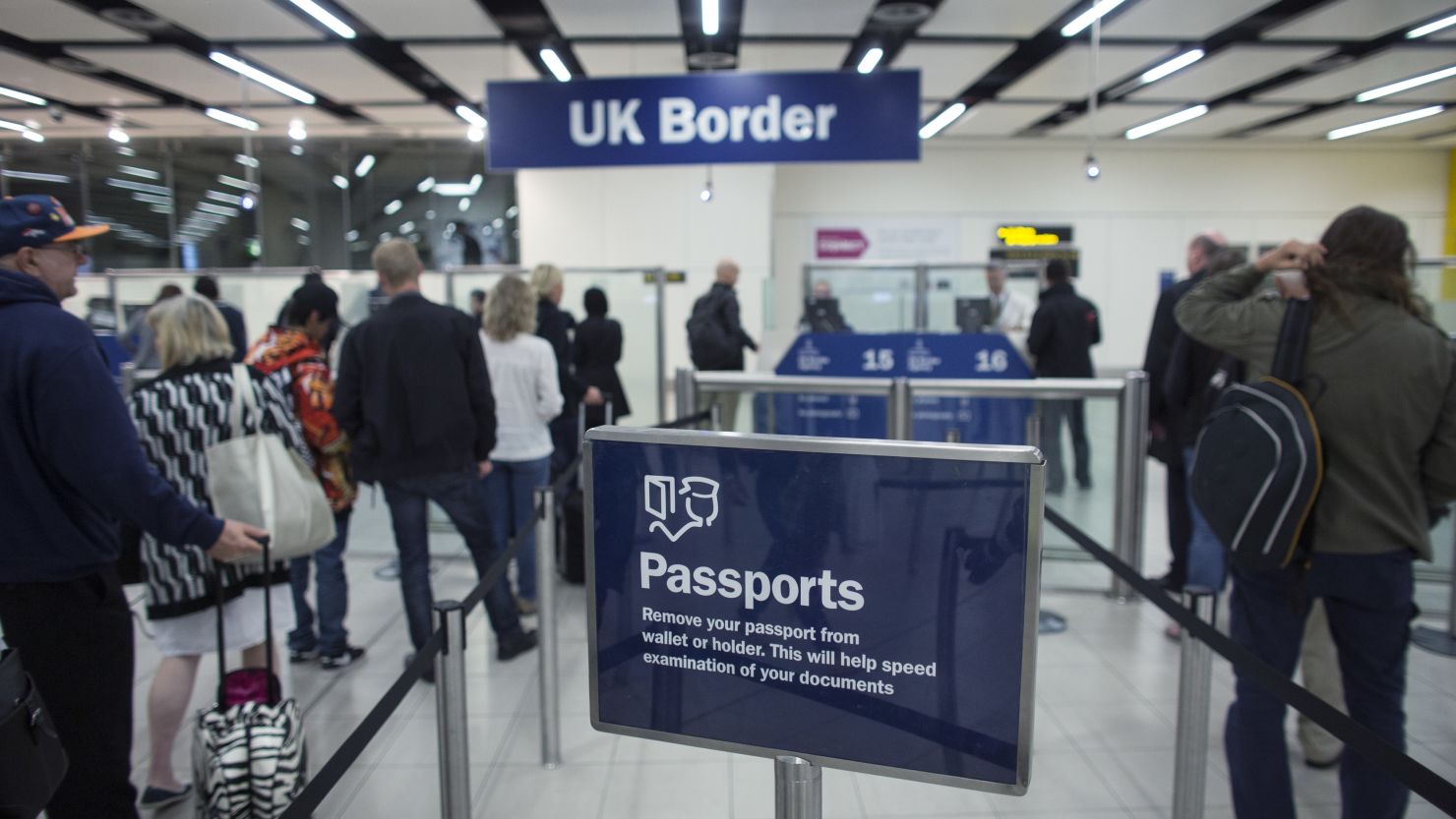 Border Force check the passports of passengers arriving at Gatwick Airport on May 28, 2014 in London, England.