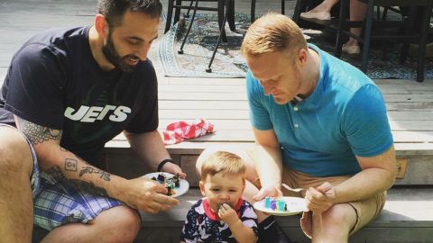 Rocco Forgione, left, his husband, Corey Martin, and their son, Forge, 2.