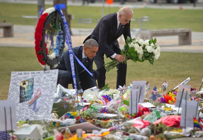 President Obama and Vice President Joe Biden place flowers at a memorial on Thursday, June 16, for the victims of the nightclub shooting in Orlando. At least 49 people <a href="index.php?page=&url=http%3A%2F%2Fwww.cnn.com%2F2016%2F06%2F12%2Fus%2Fgallery%2Forlando-shooting%2Findex.html" target="_blank">were killed in the massacre,</a> the deadliest mass shooting in U.S. history.
