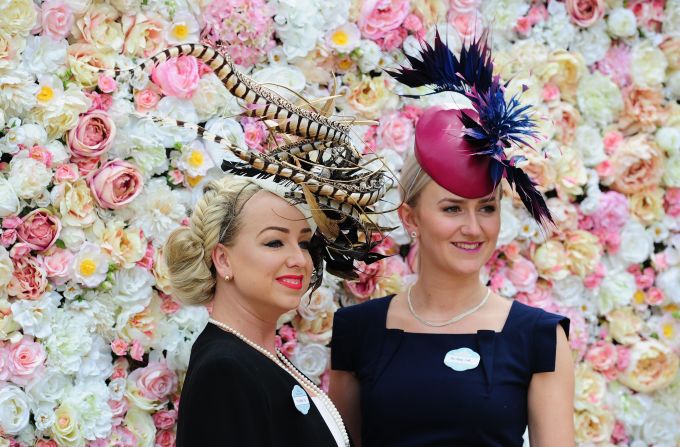 Women pose during the third day of Royal Ascot 2016 at Ascot Racecourse on Thursday June 16, in Ascot, England. The Thursday of Royal Ascot is also known as Ladies' Day, where traditional fashion takes center stage.