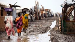 Women carry their belongings inside the Protection of Civilians (PoC) site in Malakal, South Sudan, on June 14.