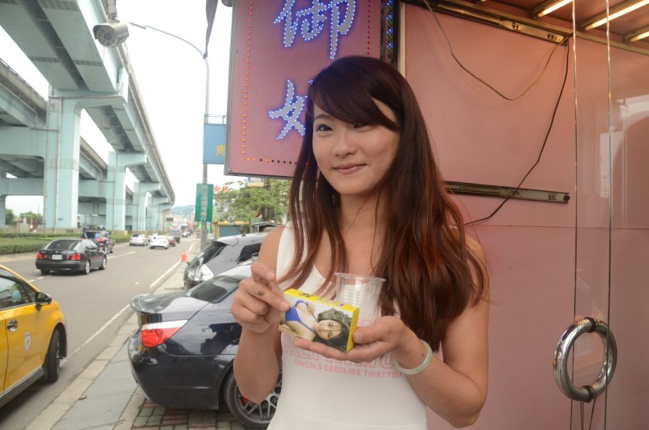 Bao Bao, a betel nut seller, holds a box of nuts a cup for chewers to spit in. Taiwan wants people to kick the habit. Since 2014, anyone caught spitting betel nut juice in the capital of Taipei will be fined and required to attend withdrawal classes. The tradition is under fire for its negative health impacts and several medical research studies show that chewing betel nuts is highly carcinogenic. 