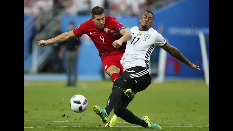Lewandowski collides with German defender Jerome Boateng.