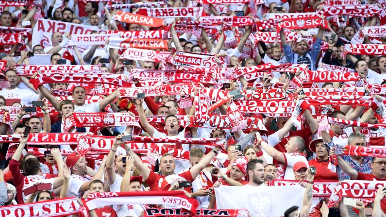 Poland supporters wave scarves at the Stade de France north of Paris.