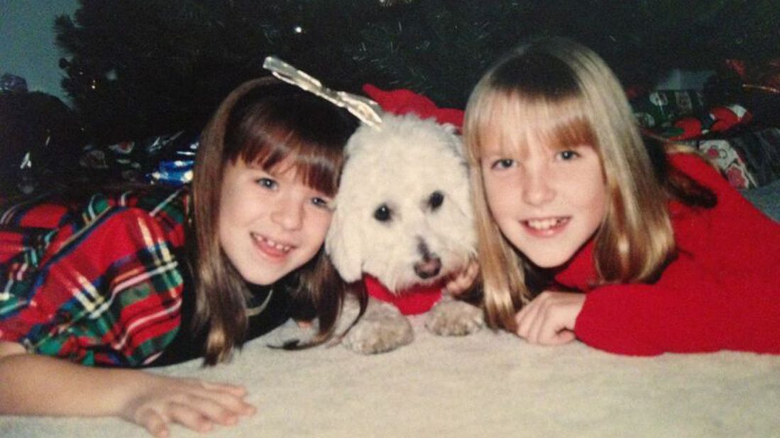 Shannon Kopp at age 11, right, with her sister, Julie, 8, and their childhood dog Sugar on Christmas in 1995.