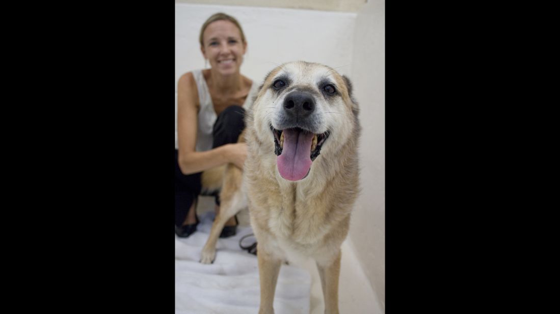 When Kopp struggled with destructive urges or felt anxiety over her body and food, she sought comfort in the dog kennels. Here, she sits with Ranger, a 12-year-old shepherd who came to the San Diego Humane Society as a stray, in 2011.
