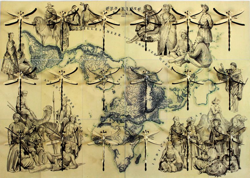 In "Atlante del Popoli" (Atlas of Peoples), 2015, large hand-carved dragonflies superimposed over a map of the world represent the idea of freedom. 