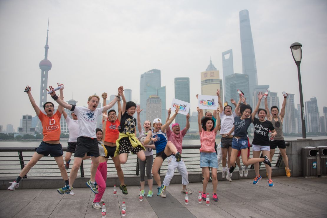 Participants pose for a photo at a Shanghai pride event. 