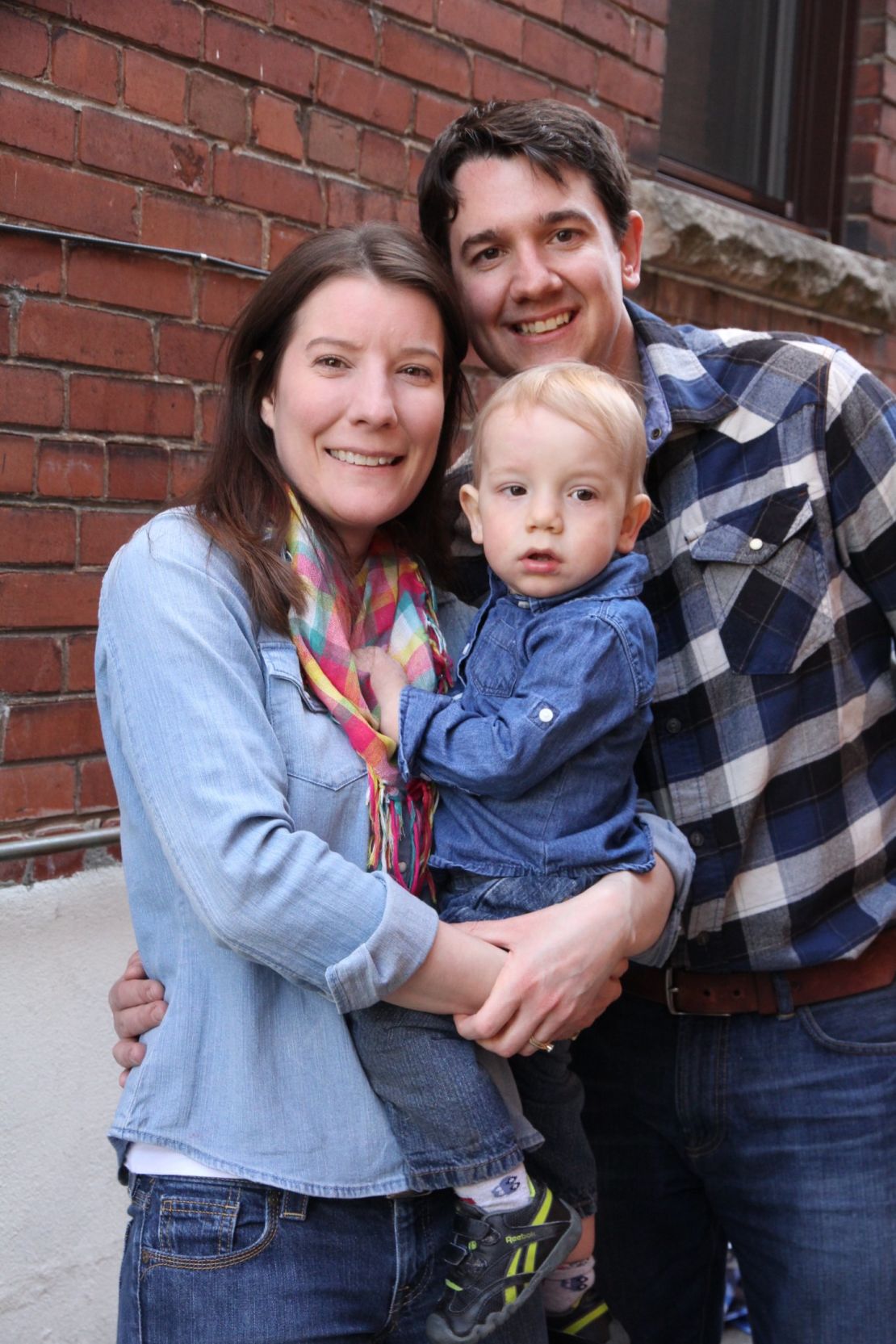 Jonathan Lee along with his wife and son, 2