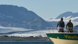 US President Barack Obama looks at Bear Glacier during a boat tour of the Kenai Fjords National Park on September 1, 2015 in Seward, Alaska. Bear Glacier is the largest glacier in Kenai Fjords National Park.