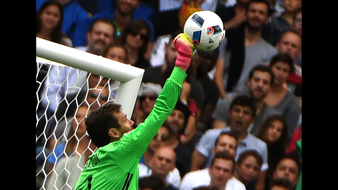 Swedish goalkeeper Andreas Isaksson punches a ball away during the match.