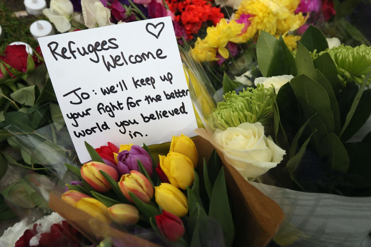 Flowers and personal messages are seen on Parliament Square on June 17. 
