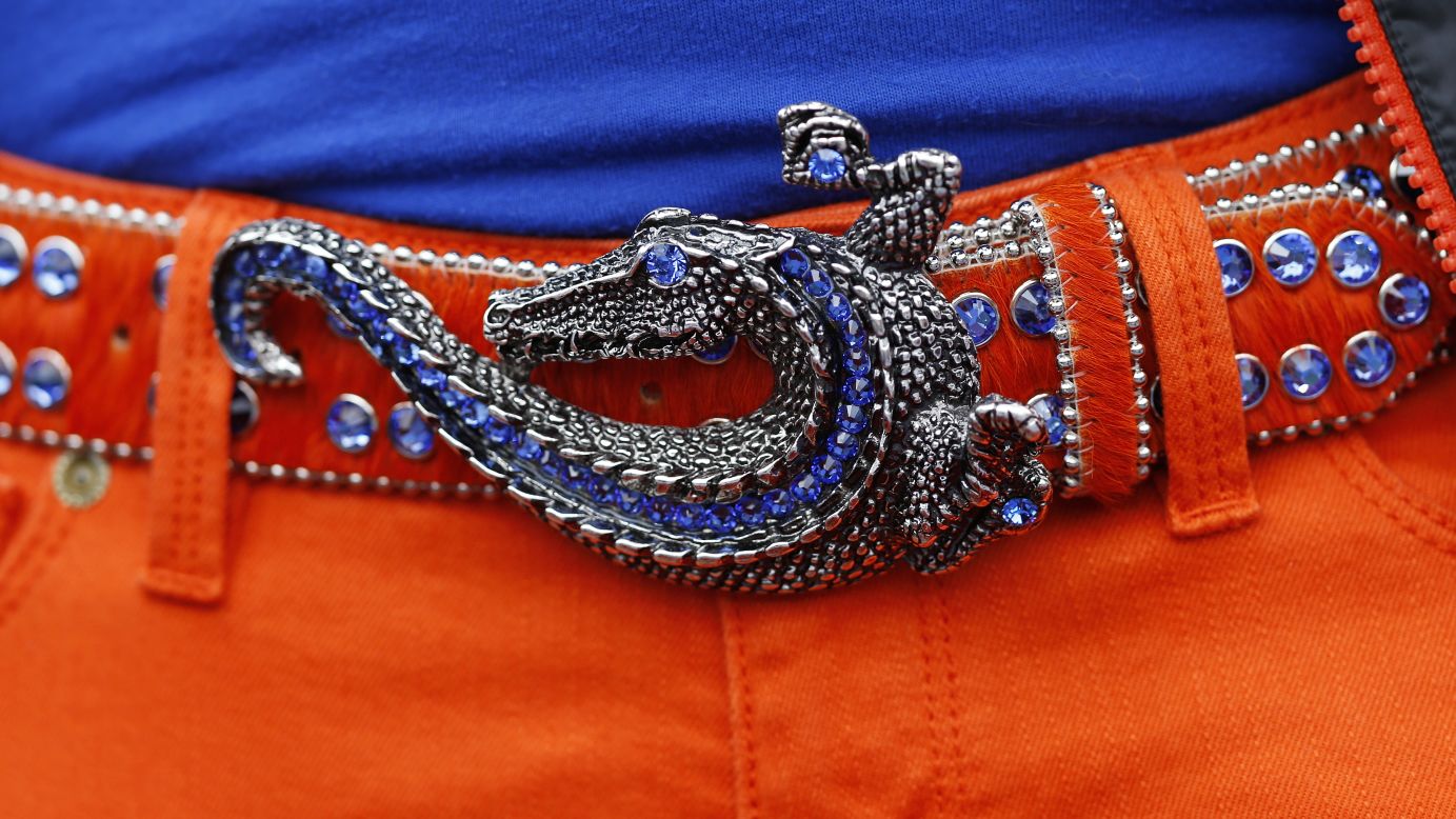 A fan wears an alligator belt buckle during a University of Florida football game in 2013. The university's sports teams are called the Gators.