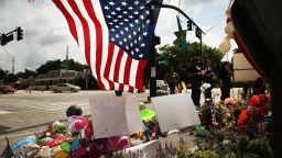 ORLANDO, FL - JUNE 17:  People visit a memorial down the road from the Pulse nightclub on June 17, 2016 in Orlando, Florida. Omar Mir Seddique Mateen killed 49 people and wounded 53 others at the popular gay nightclub early Sunday.  (Photo by Spencer Platt/Getty Images)