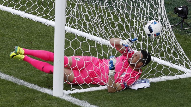 Croatian goalkeeper Danijel Subasic falls into the net after Milan Skoda scored in the 75th minute.