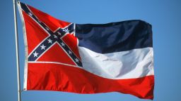 Adopted by the Mississippi Legislature in 1894. The thirteen stars, sometimes said to represent the number Confederate States and those that might have been Confederate, are said to represent the "original number of States of the Union" in the original description 