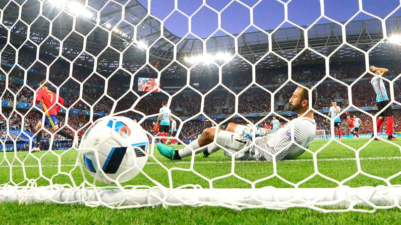 Morata, left, runs away after slipping the first goal past Turkish goalkeeper Volkan Babacan.