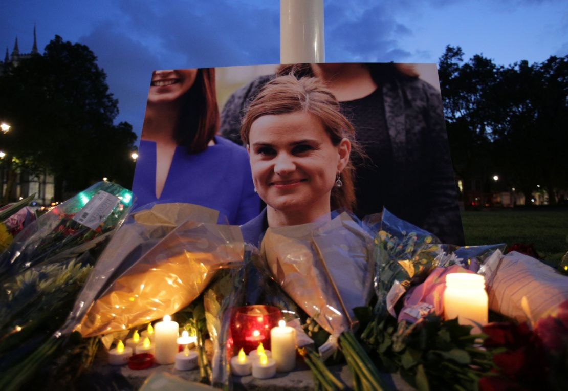 Floral tributes and candles are placed by a picture of slain Labour MP Jo Cox at a vigil in Parliament square in London on June 16, 2016.
Cox died today after a shock daylight street attack, throwing campaigning for the referendum on Britain's membership of the European Union into disarray just a week before the crucial vote.
 / AFP / DANIEL LEAL-OLIVAS        (Photo credit should read DANIEL LEAL-OLIVAS/AFP/Getty Images)