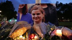 Floral tributes and candles are placed by a picture of slain Labour MP Jo Cox at a vigil in Parliament square in London on June 16, 2016.
Cox died today after a shock daylight street attack, throwing campaigning for the referendum on Britain's membership of the European Union into disarray just a week before the crucial vote.
 / AFP / DANIEL LEAL-OLIVAS        (Photo credit should read DANIEL LEAL-OLIVAS/AFP/Getty Images)