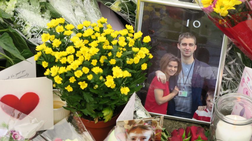 A photo of slain MP Jo Cox and her husband outside the British Prime Minister's residence lies amid floral tributes in Birstall, the northern English town where she was killed.
