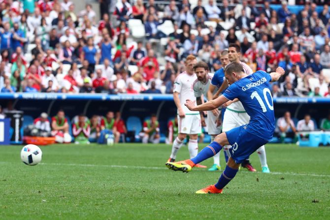 Gylfi Sigurdsson of Iceland scores a goal from the penalty spot. 