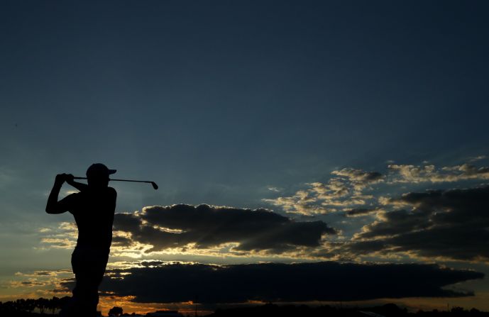 Adam Scott of Australia hits his tee shot on the fifth hole during the second round on June 17.