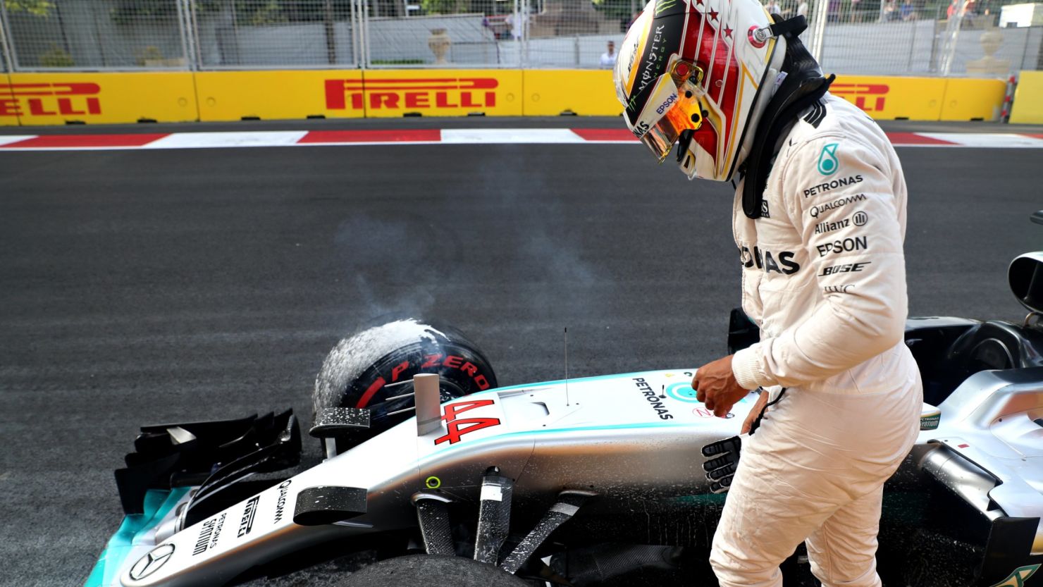 Lewis Hamilton walks away after crashing his Mercedes into the wall on the Baku circuit in final qualifying for the European Grand Prix. 