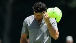 A deflated Rory McIlroy walks off his final hole of the second round at the U.S. Open having missed the cut. 