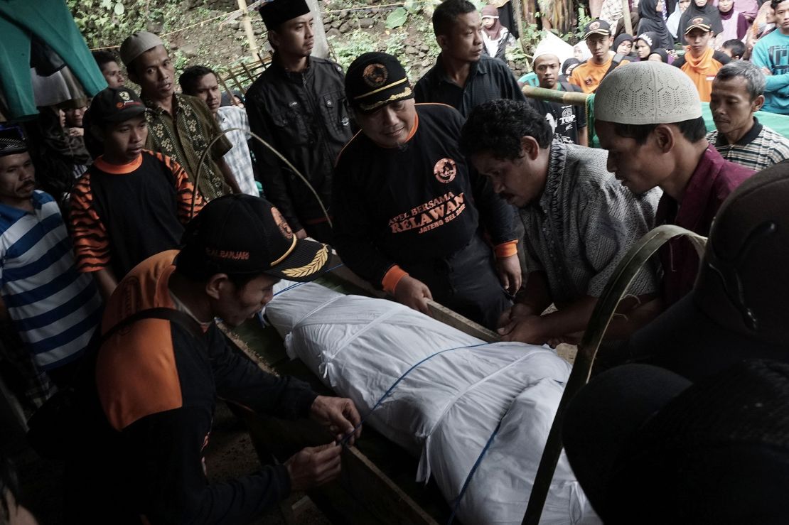 Indonesian villagers prepare for the funeral of a landslide victim in Banjarnegara on Sunday. 