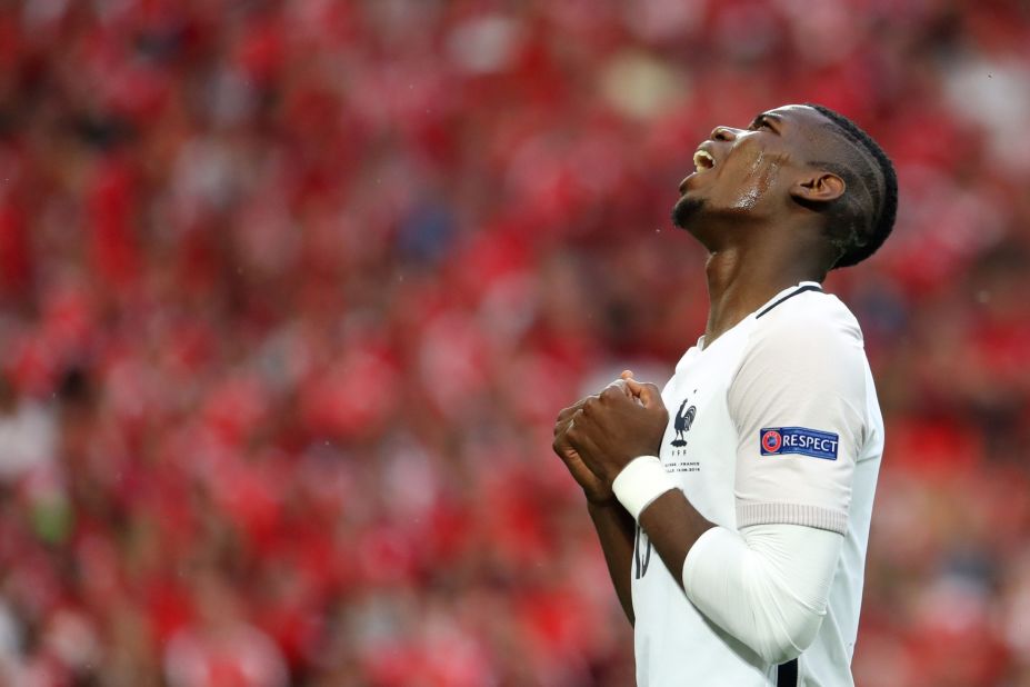 France's midfielder Paul Pogba reacts to a missed goal. 