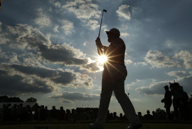 Shane Lowry watches his tee shot on the 14th hole on June 19. 