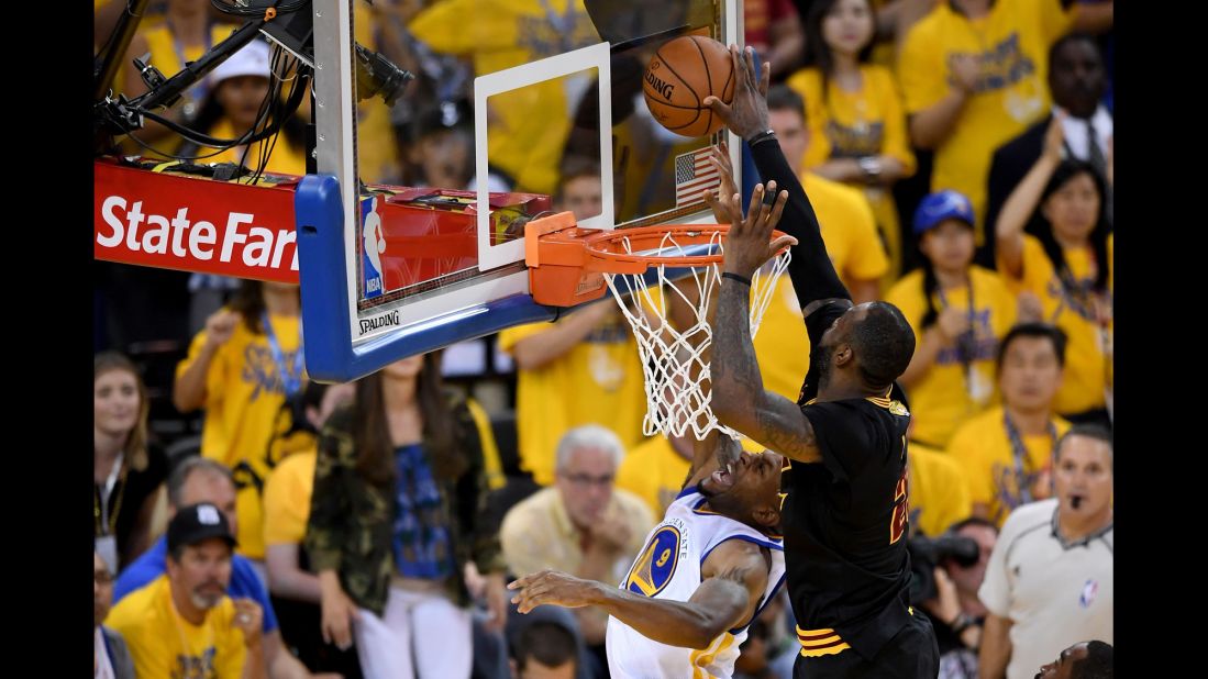 James comes up with a key block of Andre Iguodala just before Irving's 3-pointer. The game was tied at the time.