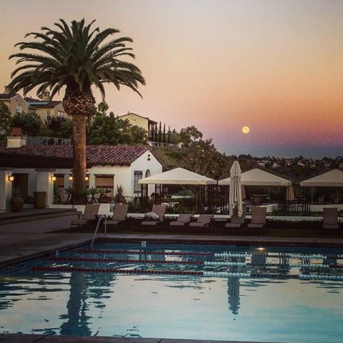 The moon says hello as it peeks over a pool in San Diego, California, on June 20.