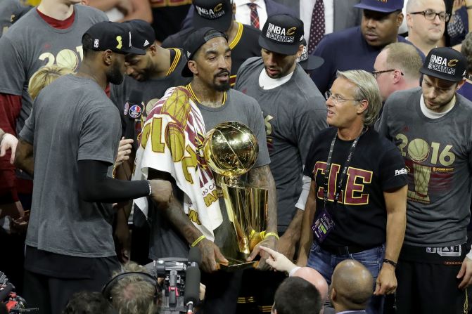 J.R. Smith (with trophy) of the Cleveland Cavaliers holds the Larry O'Brien Championship Trophy. Smith broke down in tears during the post-game press conference when asked about his relationship with his father. The Cavaliers won the championship on Father's Day in the U.S. 