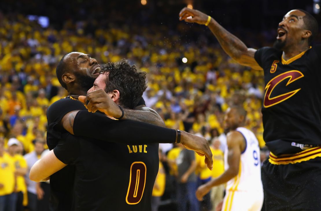 LeBron James hugs teammate Kevin Love after the Cavaliers claimed their first-ever NBA crown. 