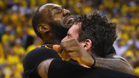 LeBron James hugs teammate Kevin Love after the Cavaliers claimed their first-ever NBA crown. 