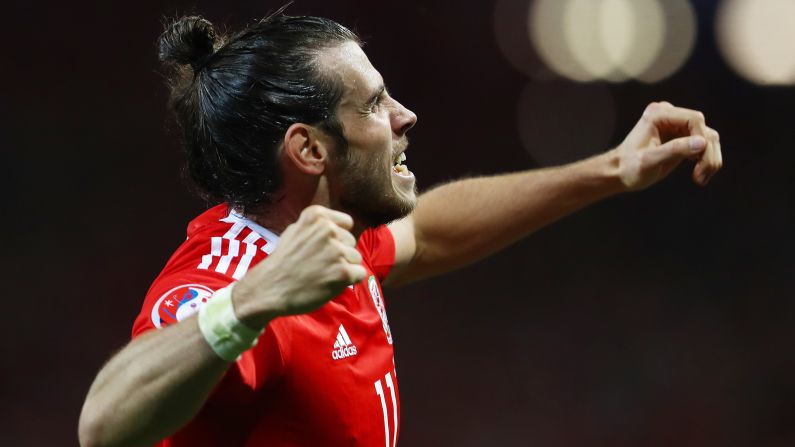 Welsh superstar Gareth Bale celebrates after scoring the third goal in the 3-0 rout of Russia on Monday, June 20. With the victory and England's 0-0 draw with Slovakia, Wales clinched first place in Group B.