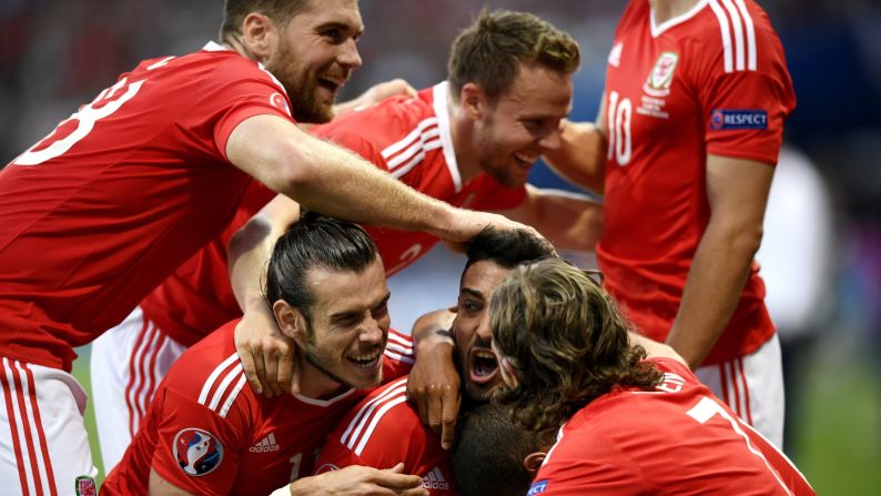 Wales celebrates the second goal of the match, which was scored by left back Neil Taylor in the first half.